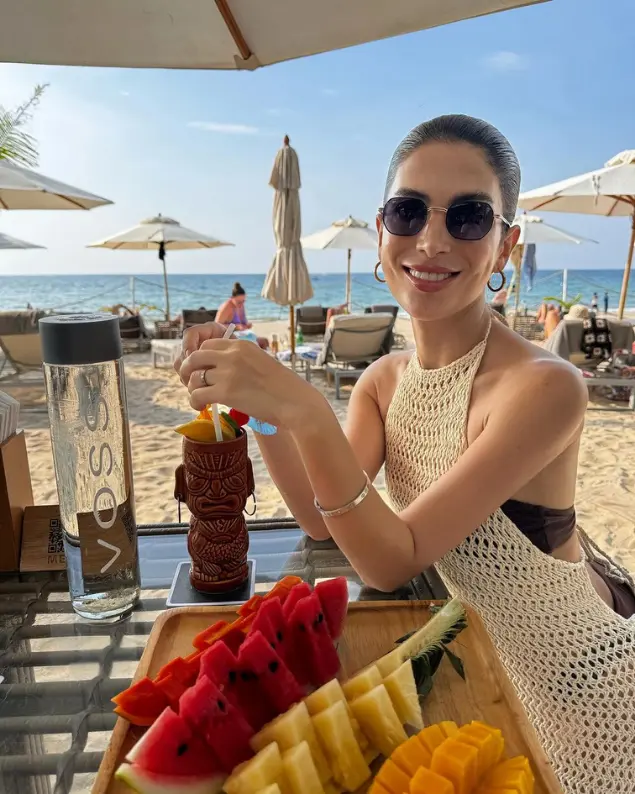 Bella Vladi with VOSS water at a beach resort